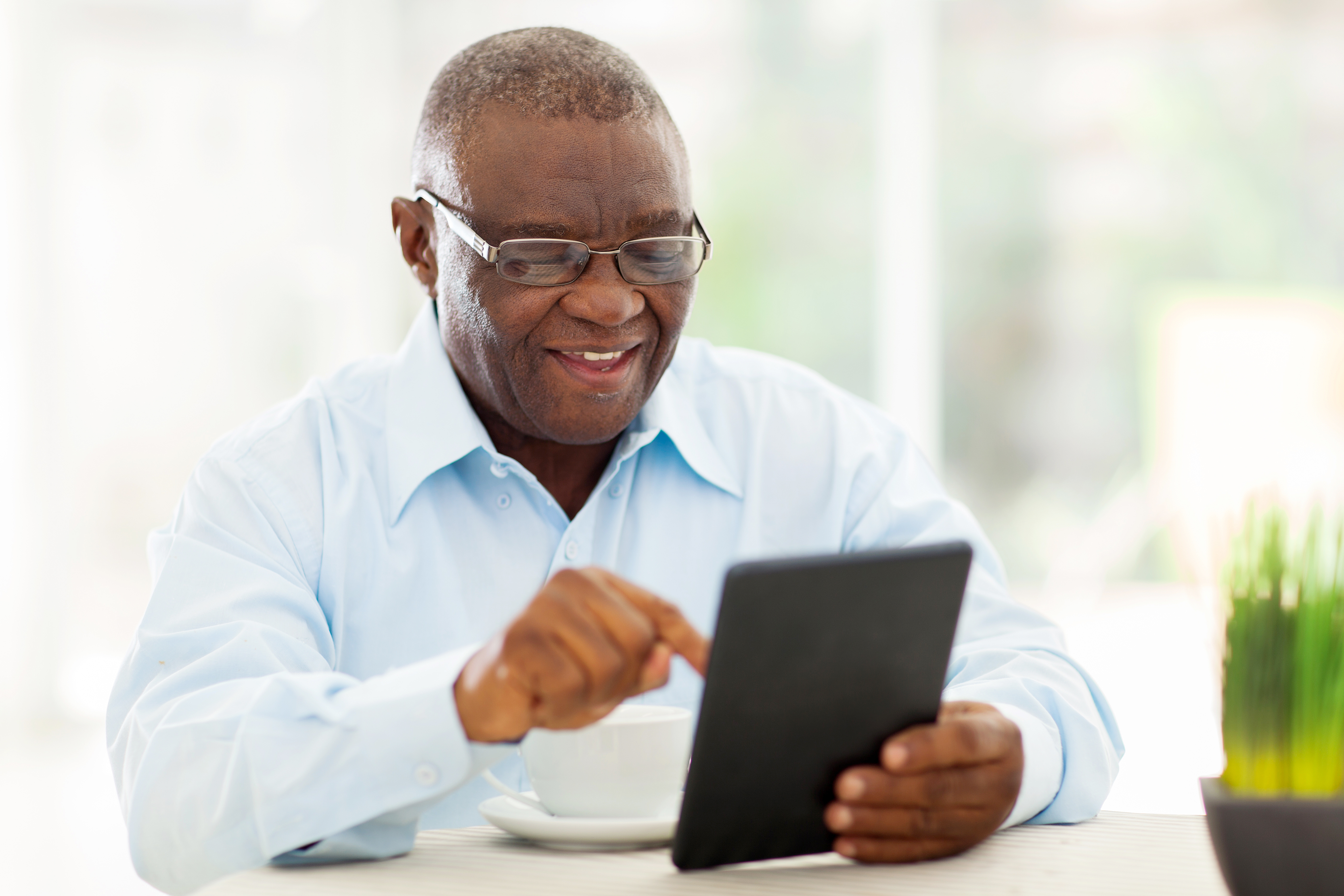 Elderly Man with a Tablet